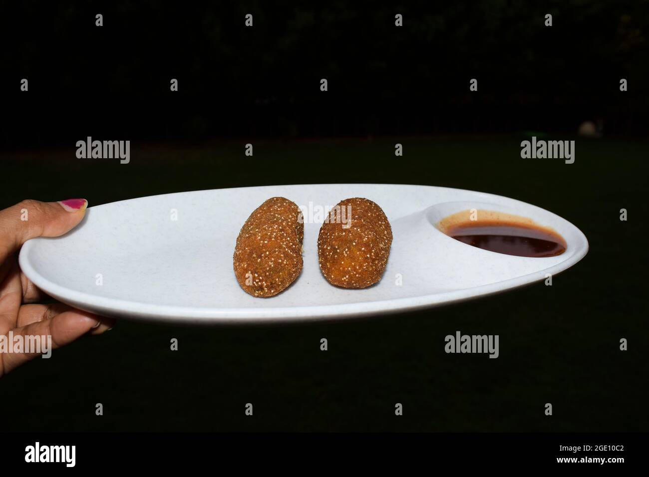 Paneer cutlet served with tomato ketchup Indian starter snacks dish