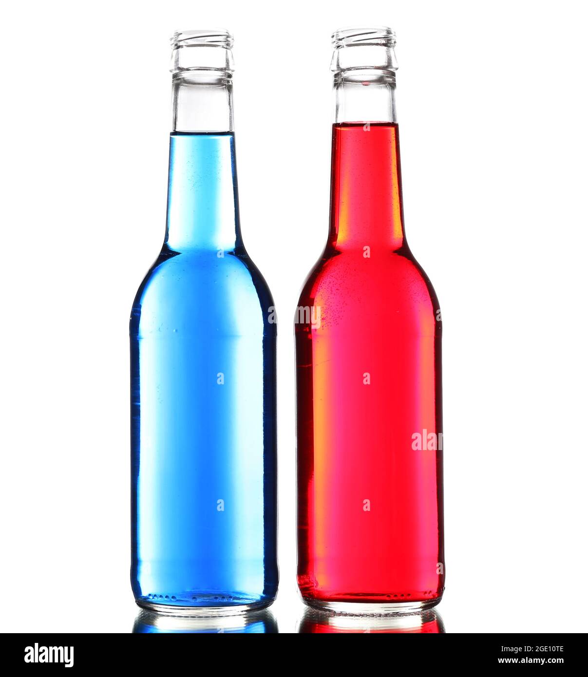 Colorful alcoholic beverages in glass bottles isolated on white Stock