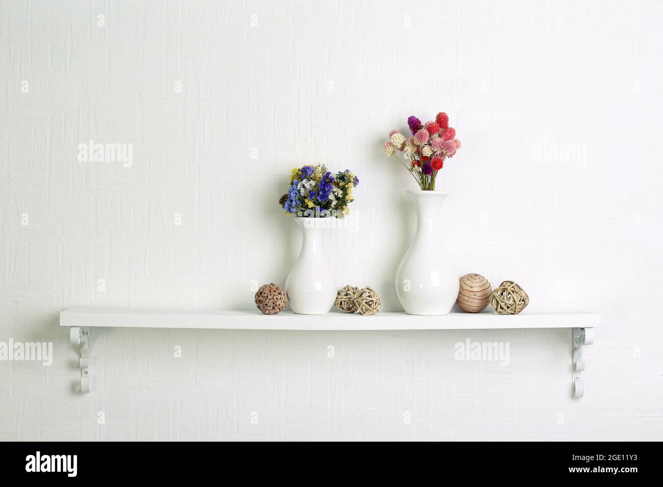 Composition of dried flowers on white wall background Stock Photo - Alamy