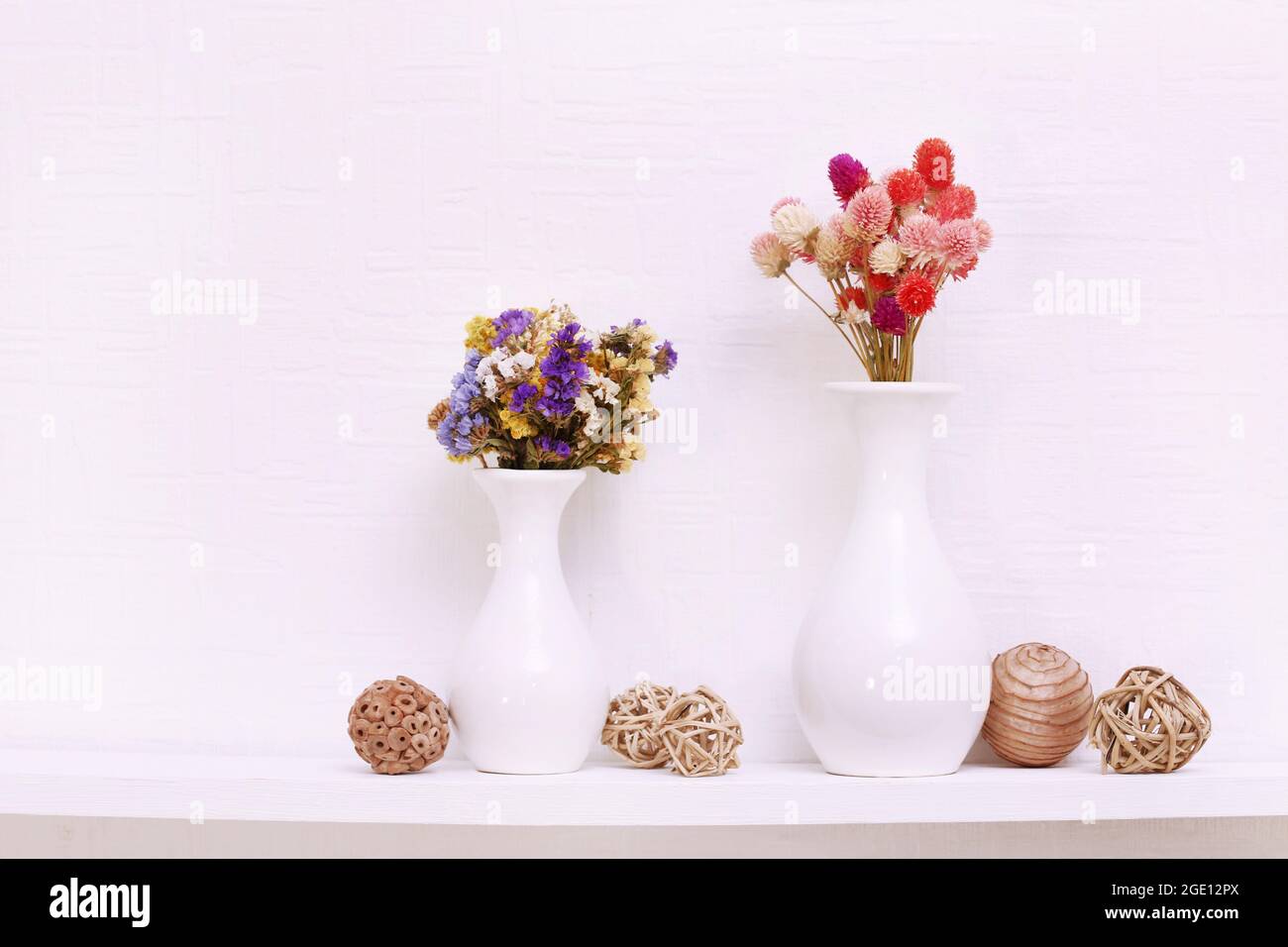 Composition of dried flowers on white wall background Stock Photo - Alamy