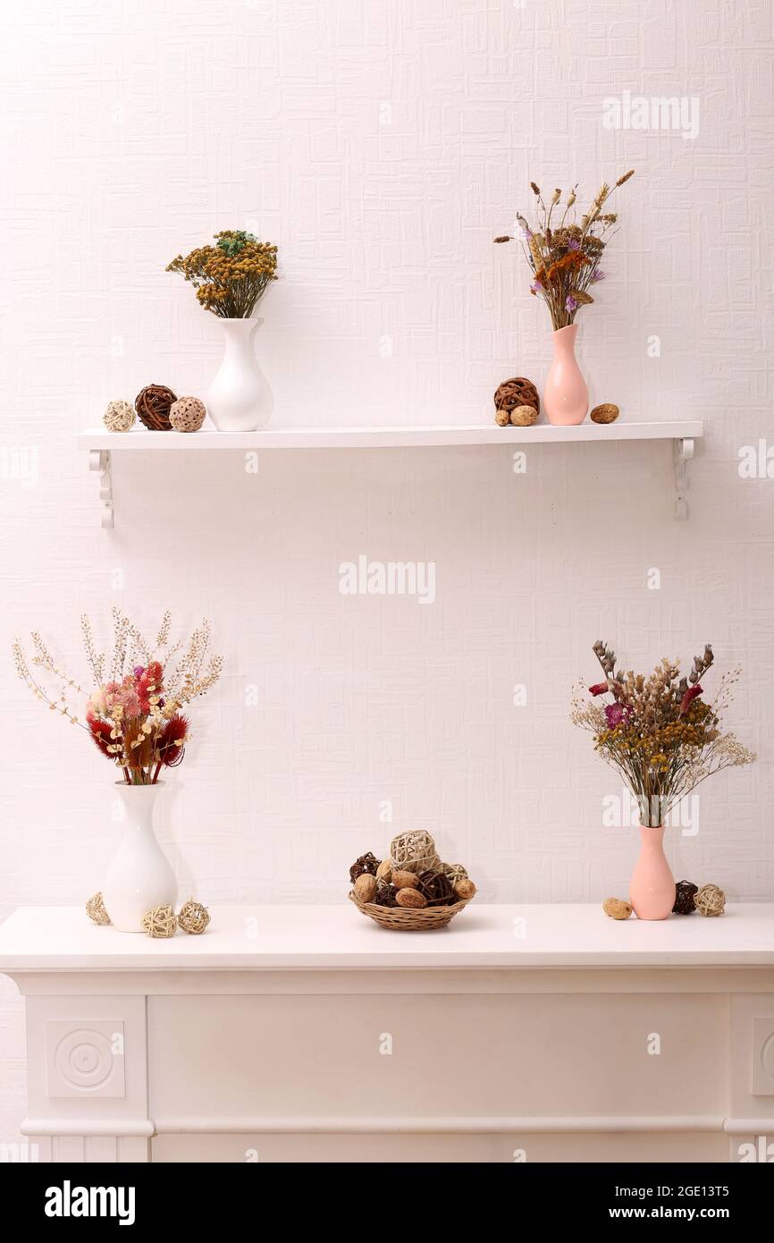 Still life of dried flowers on white wall background Stock Photo - Alamy