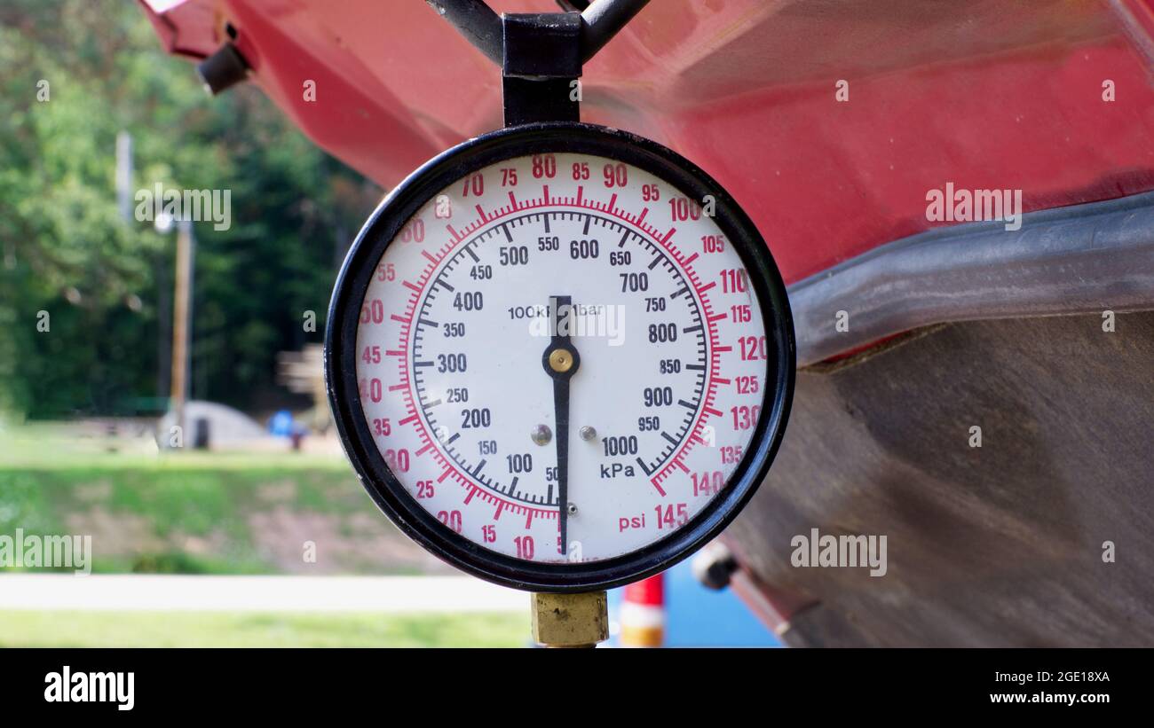 A Fuel Pressure Gauge Hanging From the Hood of a Car Stock Photo Alamy