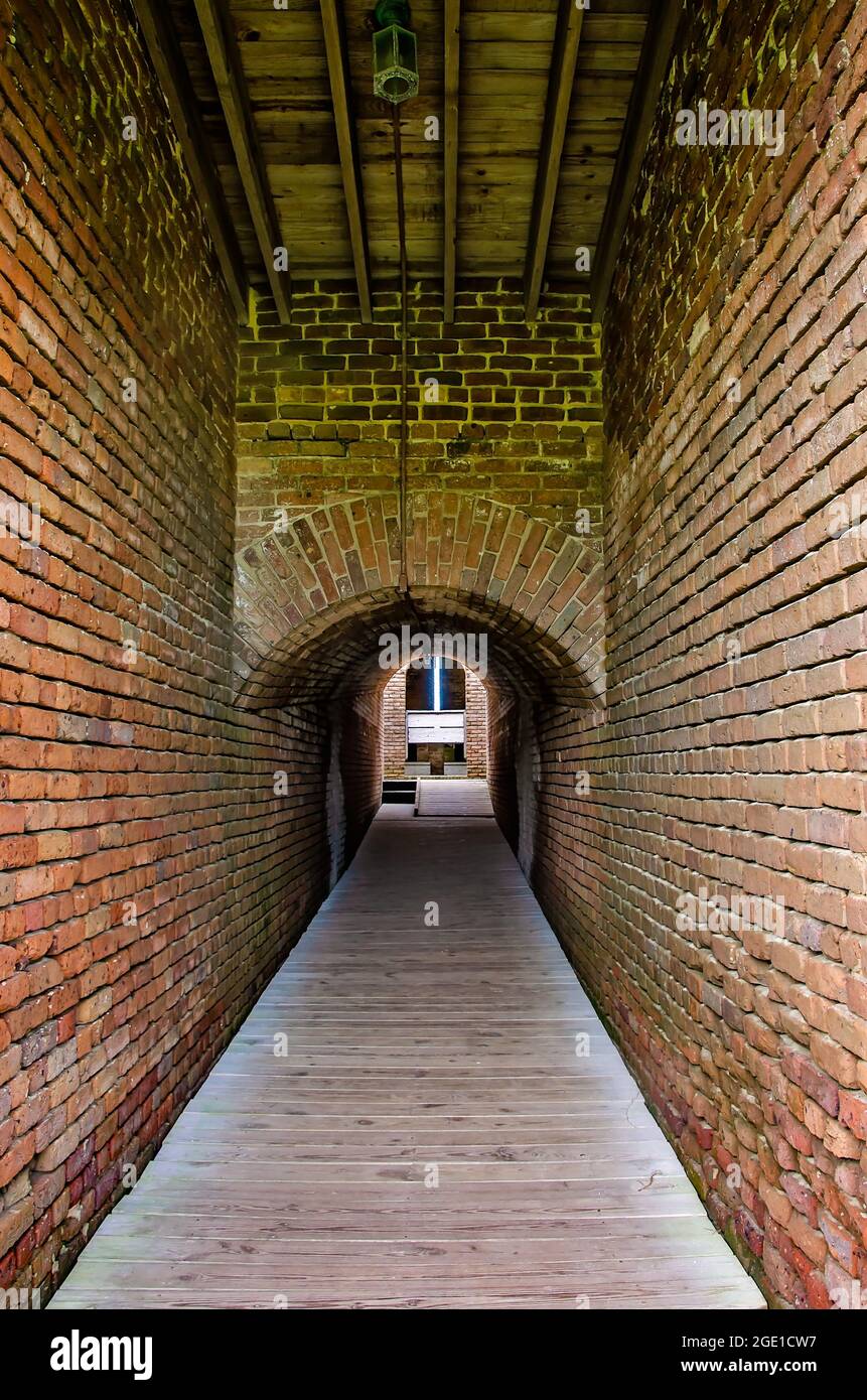 A tunnel leads to the latrine at Fort Gaines, Aug. 12, 2021, in Dauphin Island, Alabama. Stock Photo