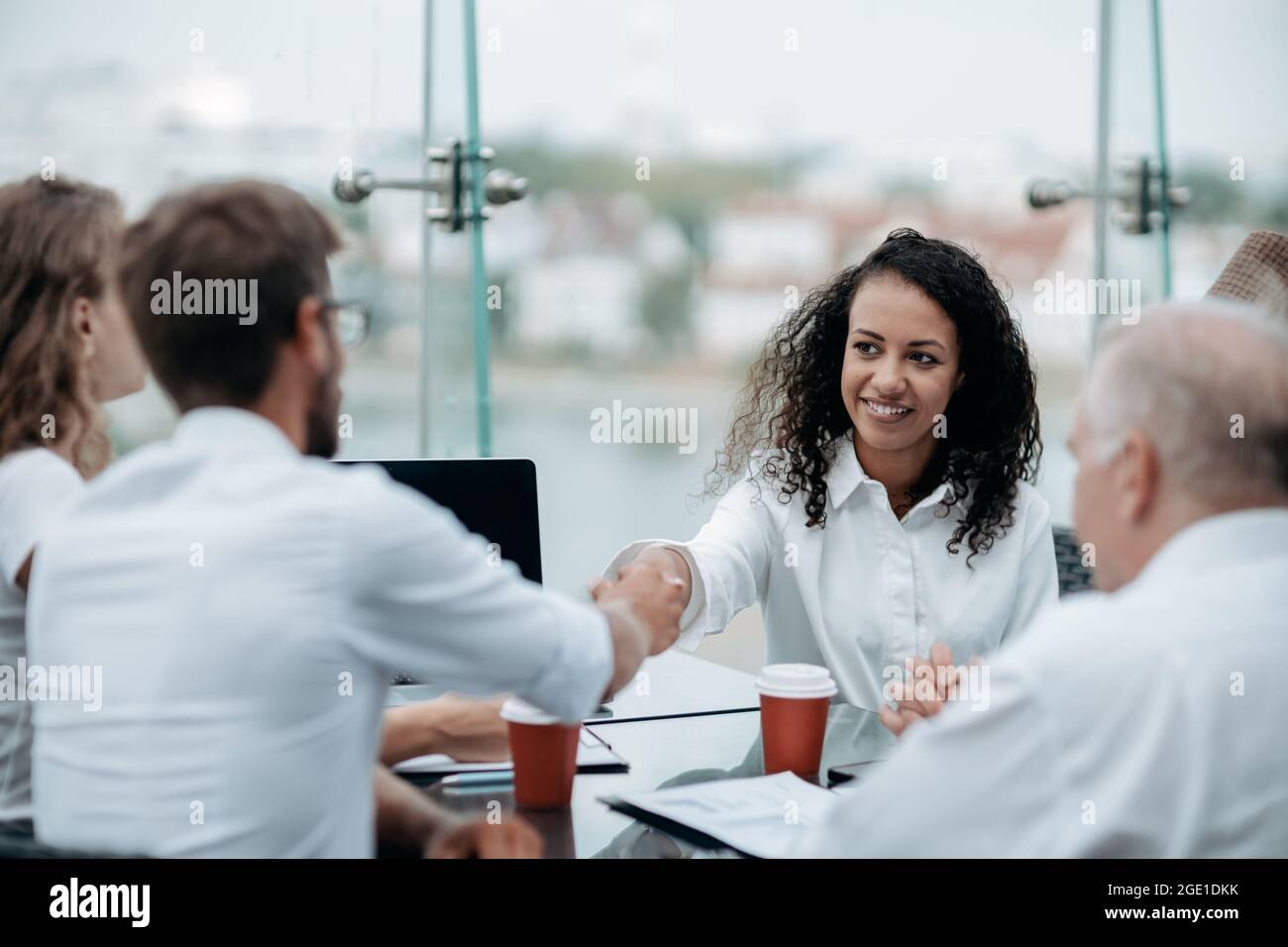 young businesswoman discussing something with her colleague. Stock Photo