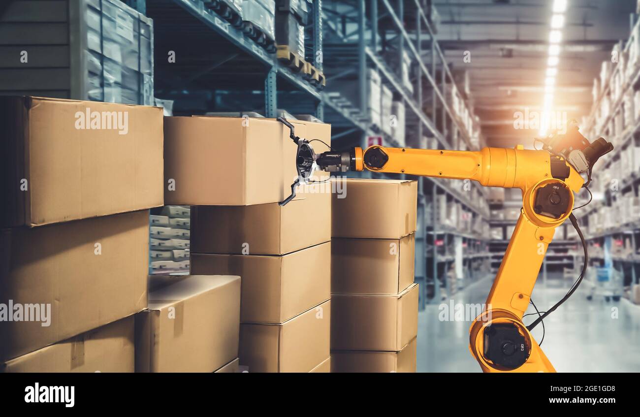 Smart robot arm system for innovative warehouse and factory digital technology . Automation manufacturing robot controlled by industry engineering Stock Photo