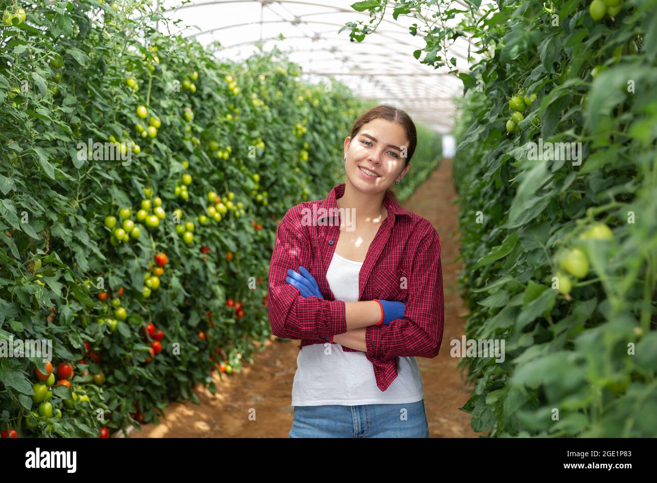 Girl in a greenhouse Stock Photo - Alamy