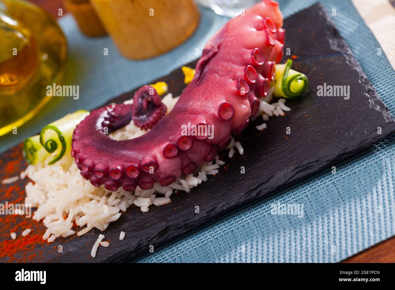 Boiled octopus with rice Stock Photo - Alamy