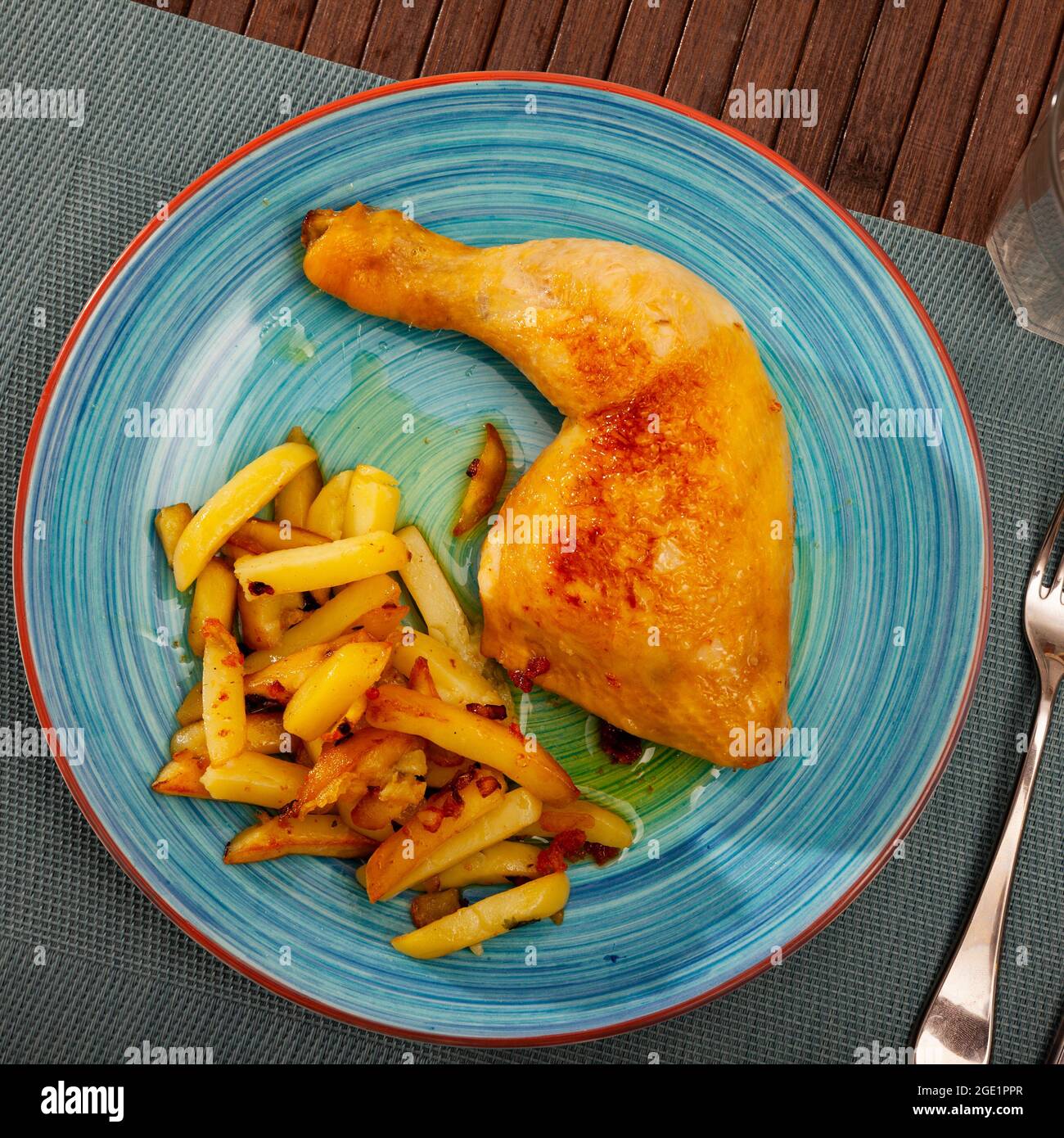 Baked chicken legs with potatoes Stock Photo - Alamy