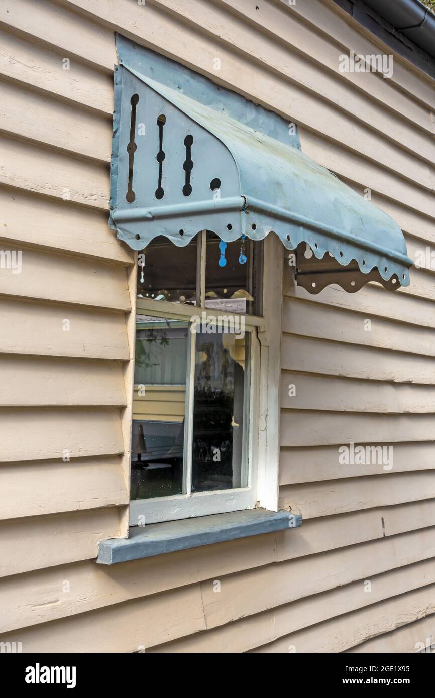 A typical Victorian window sunshade on an Australian  weatherboard cottage. Stock Photo