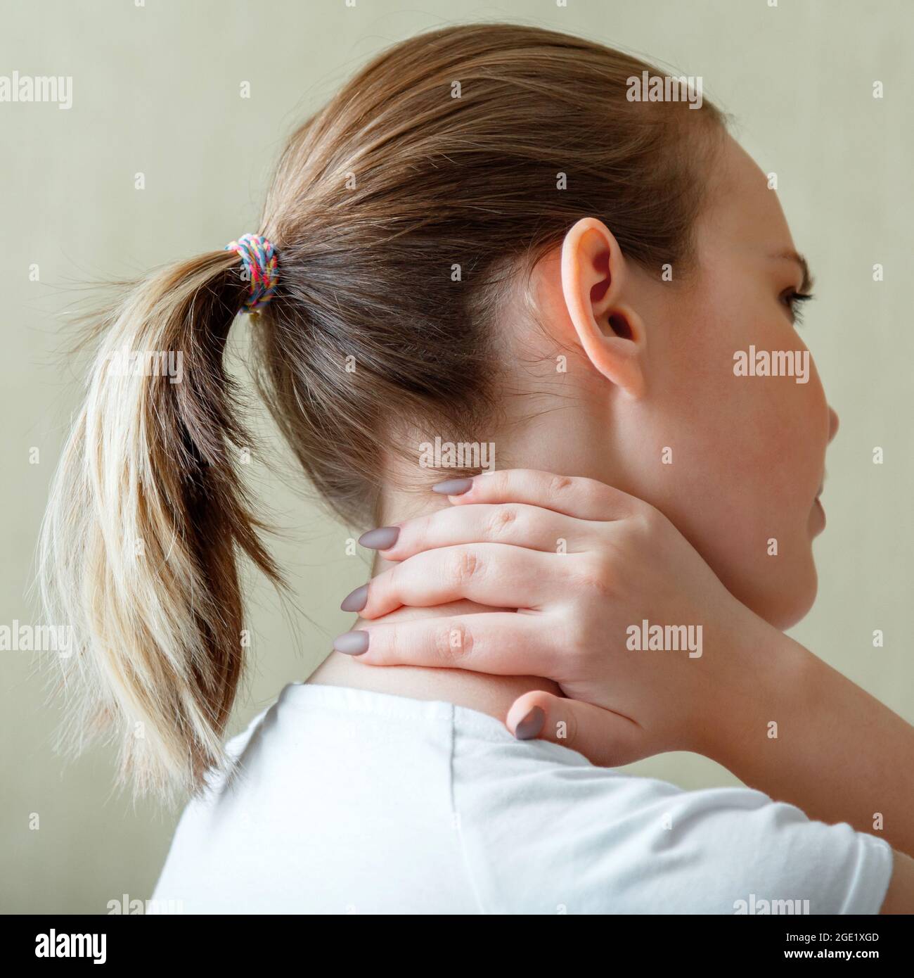 https://c8.alamy.com/comp/2GE1XGD/neck-shoulder-pain-cervical-vertebrae-woman-holds-neck-with-pain-cervical-muscle-spasm-by-hand-disease-of-musculoskeletal-system-in-young-woman-2GE1XGD.jpg