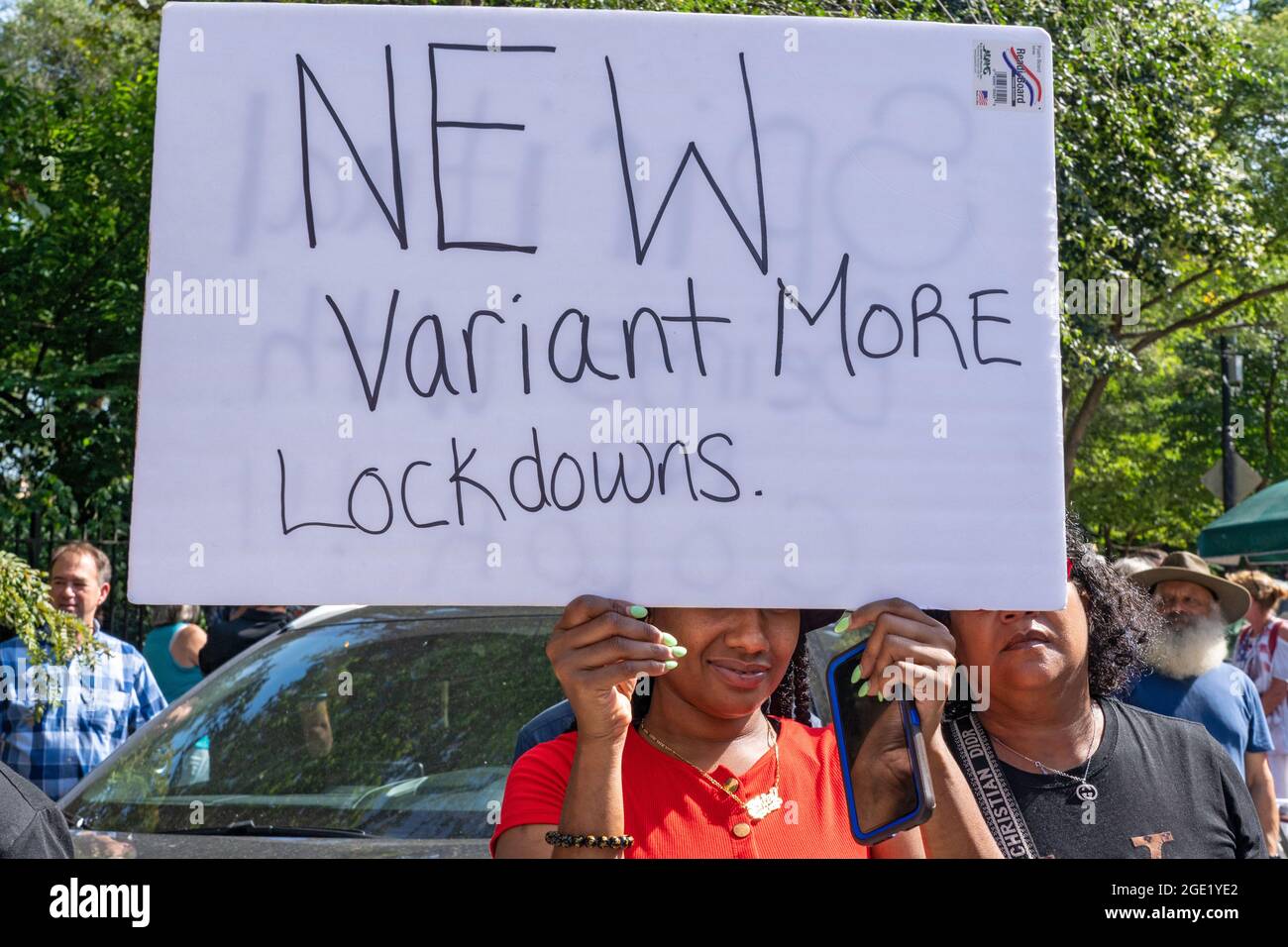 New York, United States. 15th Aug, 2021. A woman holds a sign that says New Variant More Lockdown at a Republicans Rally against COVID vaccine mandates outside Gracie Mansion in New York City.NYC vaccine mandate starts Monday, August 16th; Proof of coronavirus (COVID-19) vaccination will be required to attend indoor restaurants, gyms, and entertainment venues with enforcement of the mandate to begin on September 13th. Credit: SOPA Images Limited/Alamy Live News Stock Photo