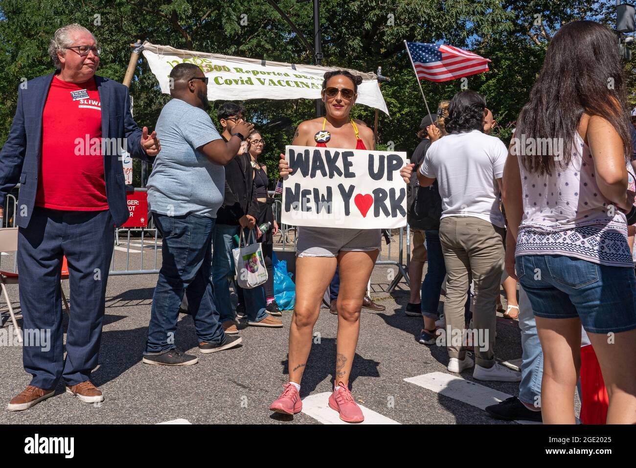 New York, United States. 15th Aug, 2021. A woman holds a sign that says wake up New York at a Republicans Rally against COVID vaccine mandates outside Gracie Mansion in New York City.NYC vaccine mandate starts Monday, August 16th; Proof of coronavirus (COVID-19) vaccination will be required to attend indoor restaurants, gyms, and entertainment venues with enforcement of the mandate to begin on September 13th. (Photo by Ron Adar/SOPA Images/Sipa USA) Credit: Sipa USA/Alamy Live News Stock Photo