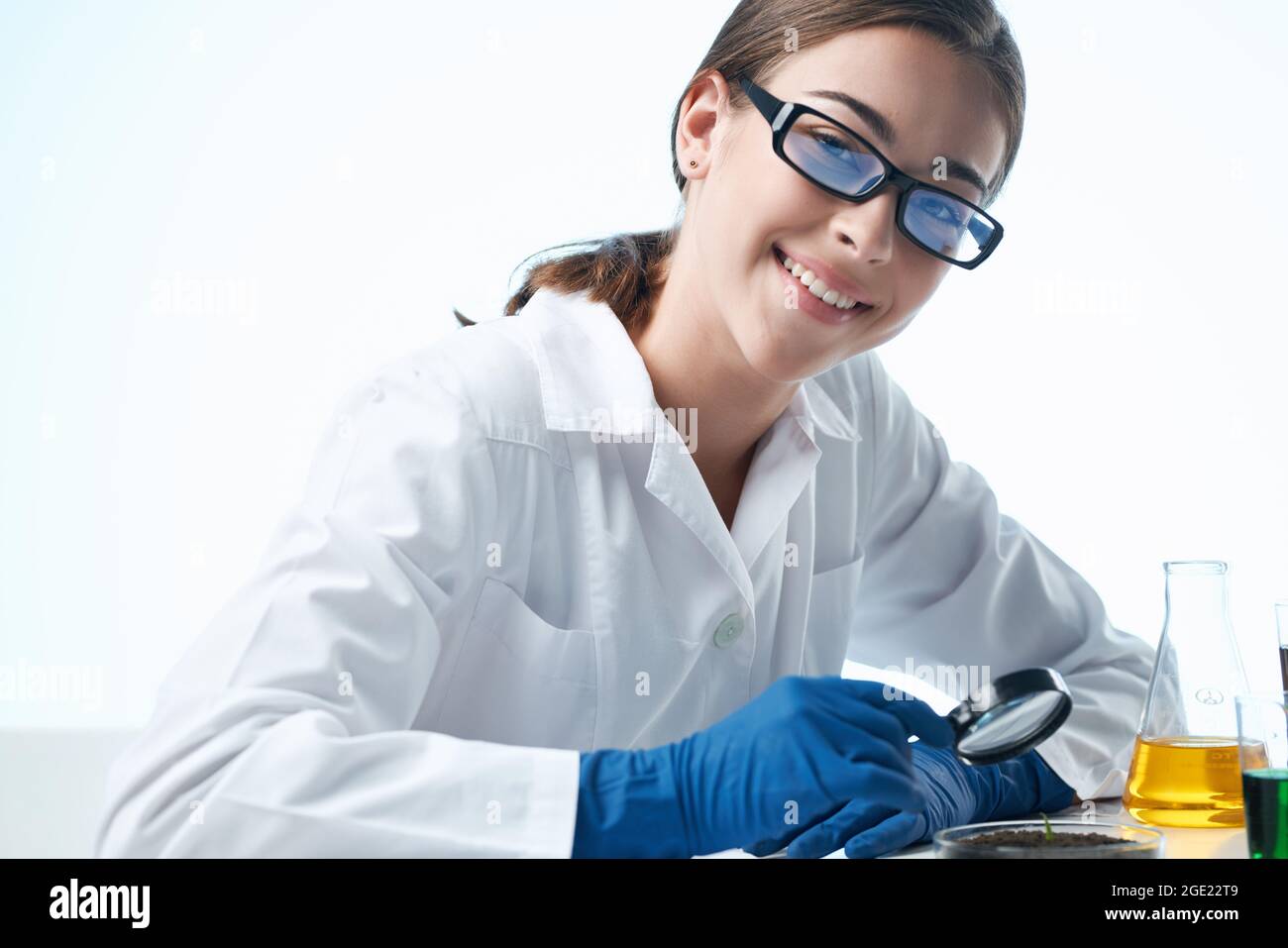 laboratory assistant at his desk research microbiology technology Stock
