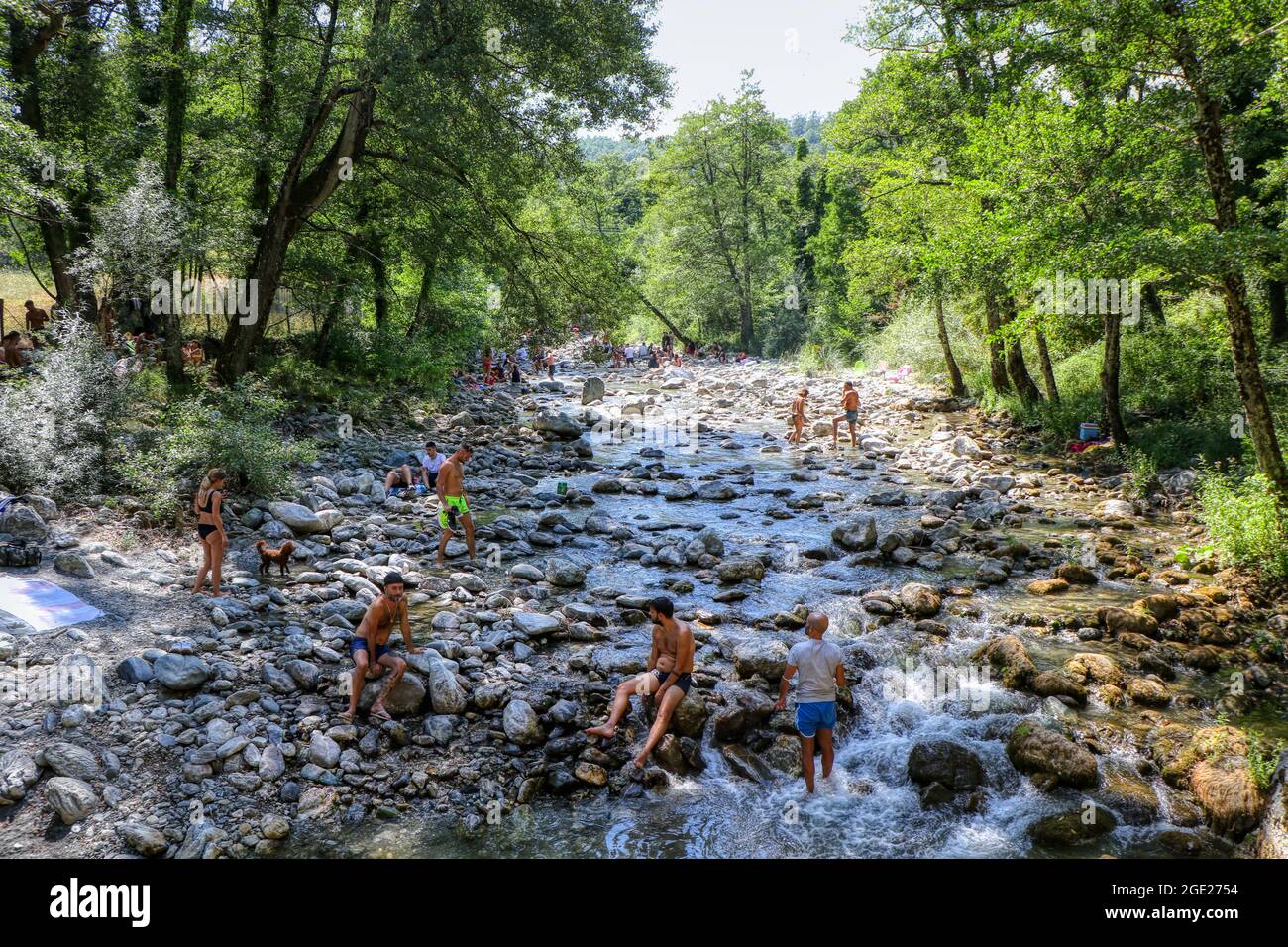 People relaxing on a summer day at the Peschiera Torrent in the Magnano Woods in Chiaromonte, Potenza, Basilicata, Italy Stock Photo