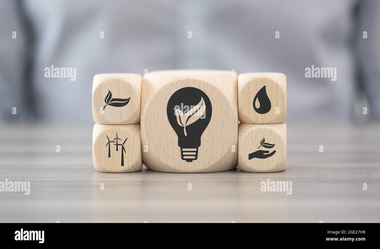 Wooden blocks with symbol of green energy concept Stock Photo - Alamy