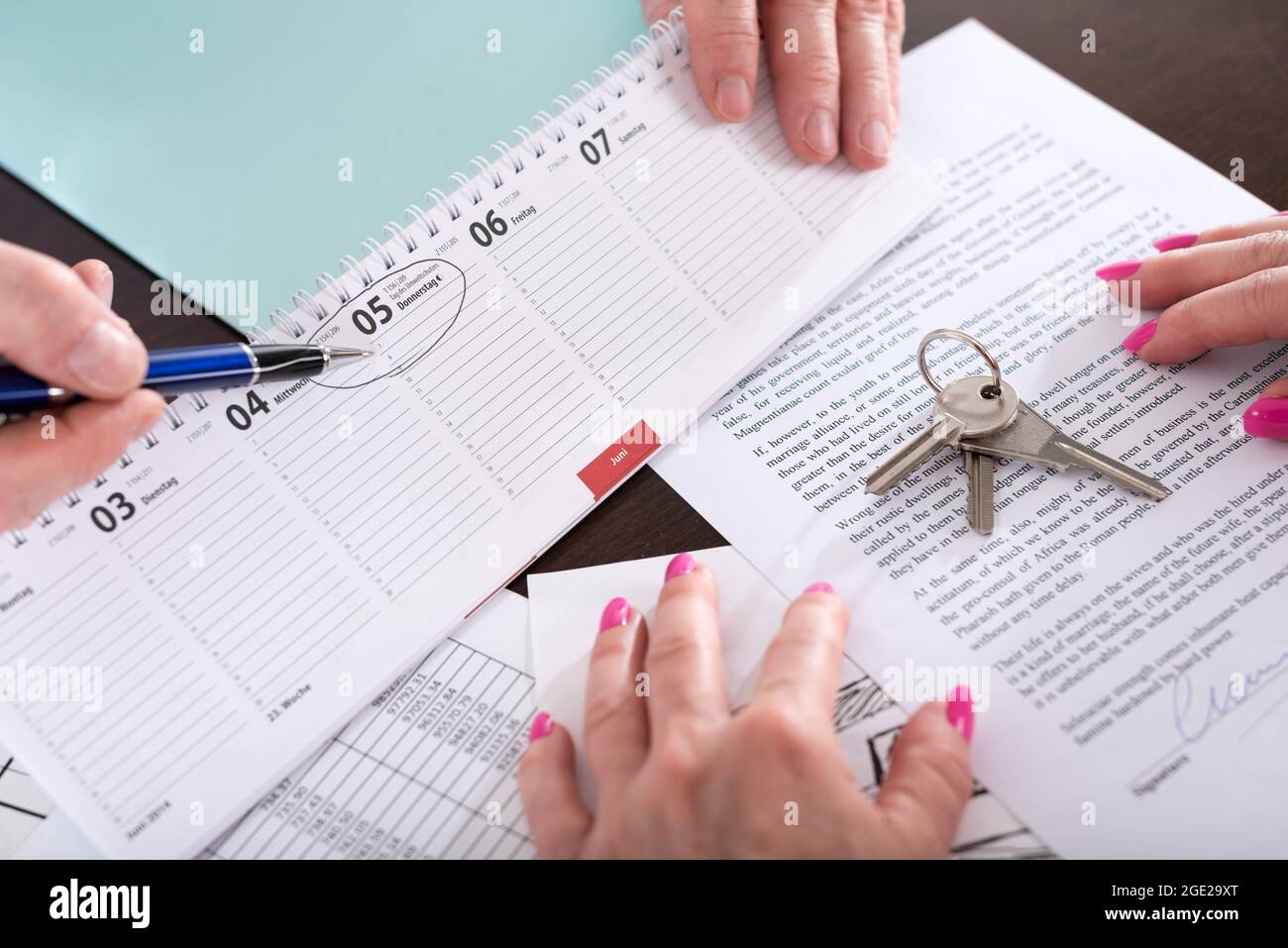 Real estate agent showing the effective date of lease on calendar ...
