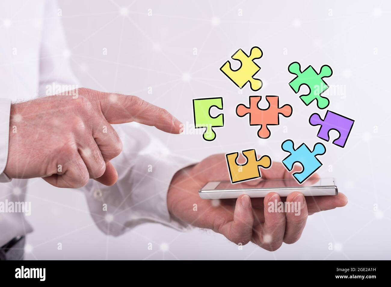 Teamwork concept above a smartphone held by a man Stock Photo - Alamy