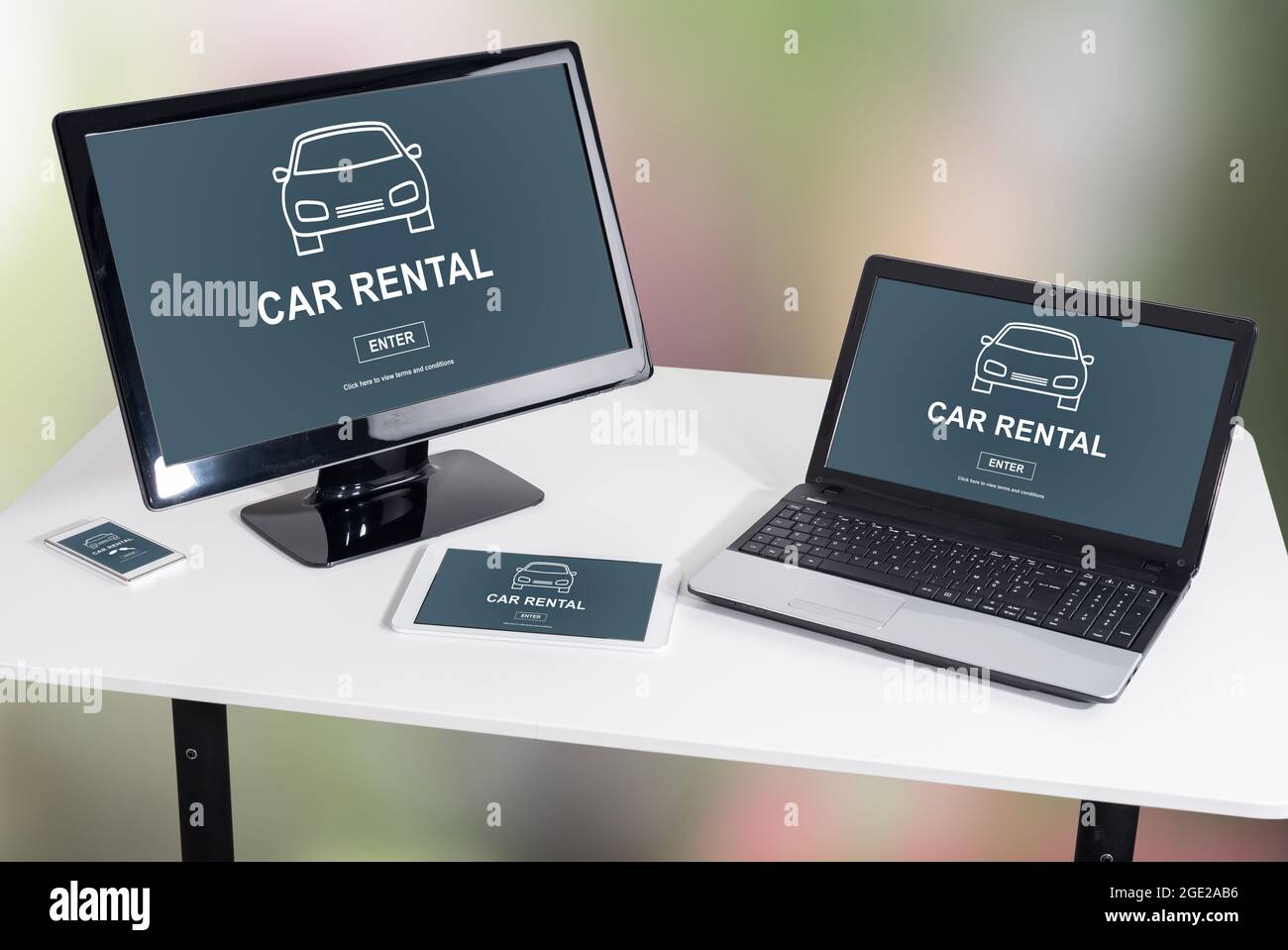 Car rental concept shown on different information technology devices ...