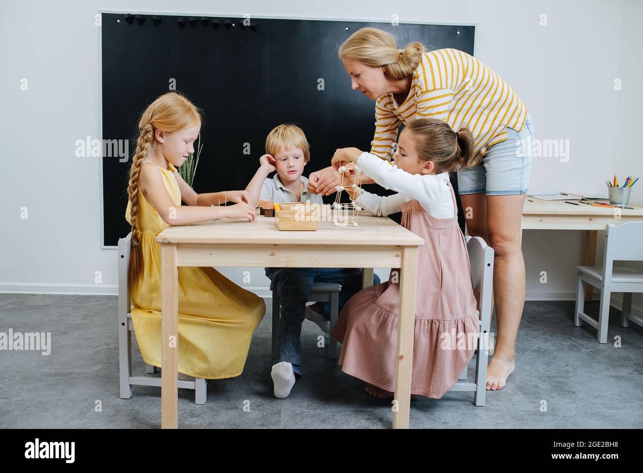 Caring teacher hi-res stock photography and images - Alamy