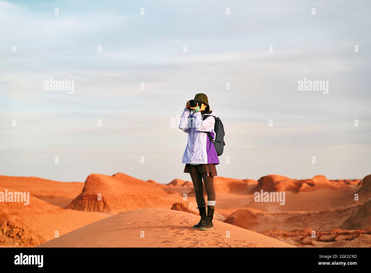 asian woman photographer standing in a national geological park taking a picture Stock Photo
