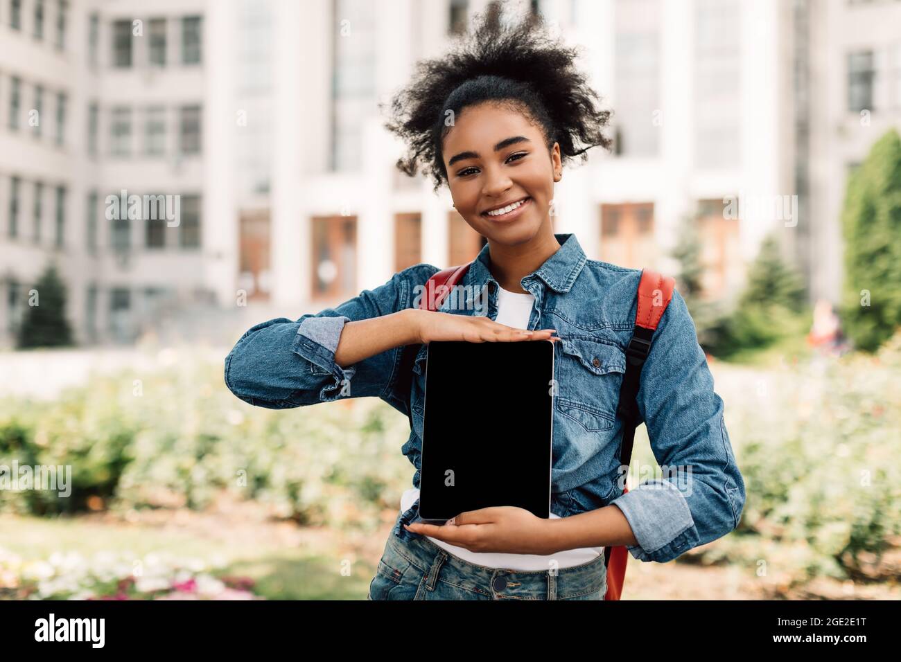 Black College Student Girl Showing Tablet Empty Screen Standing Outdoors Stock Photo