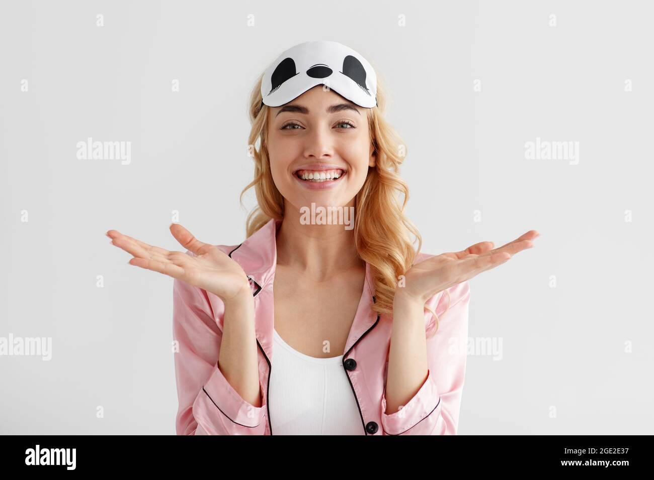 Portrait of positive female blogger model, wake up in morning has good mood Stock Photo