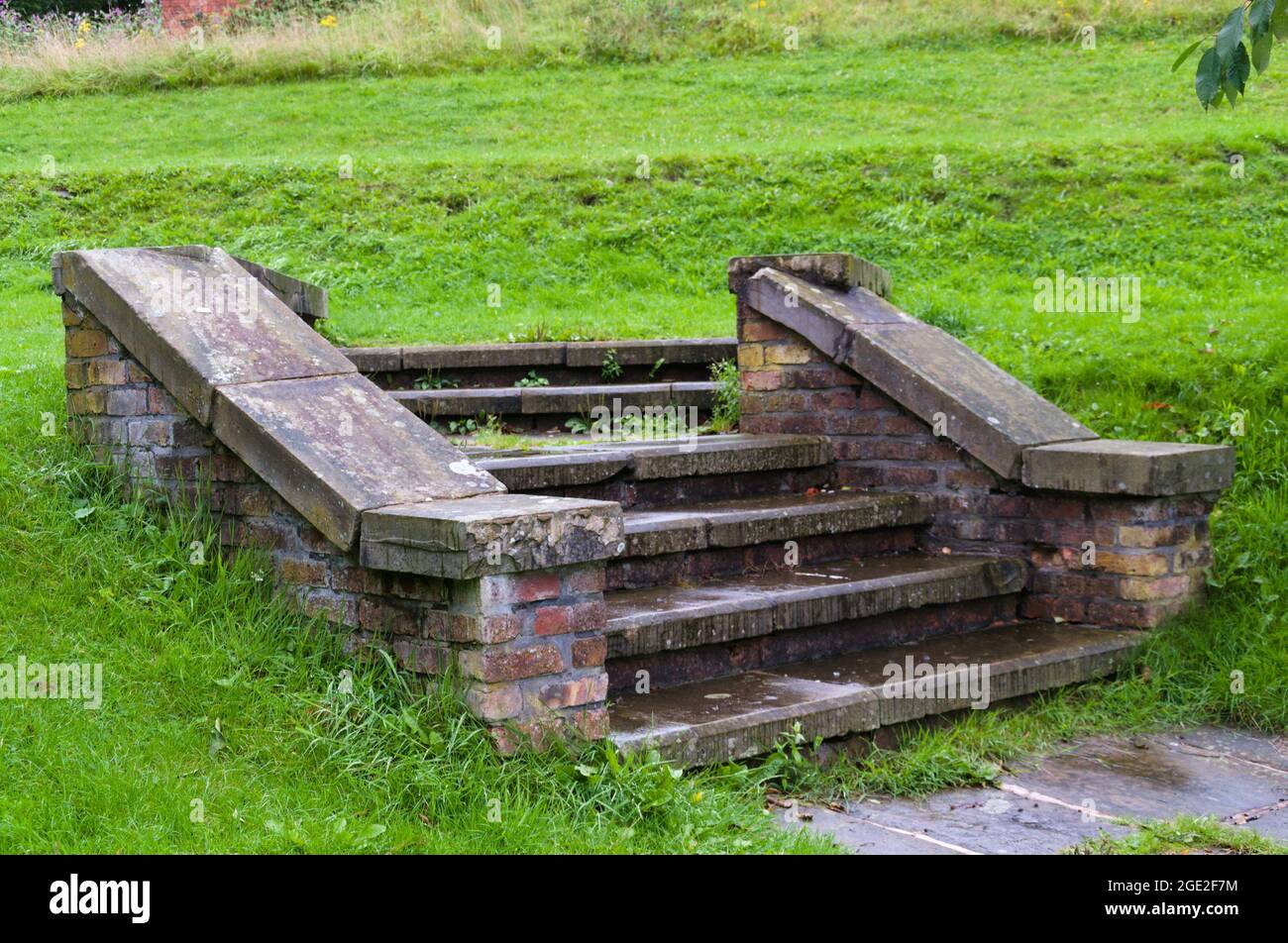 Old steps now leading to nowhere at the former Park Bridge ironworks, founded in 1786, near Ashton under Lyne, Greater Manchester, UK Stock Photo