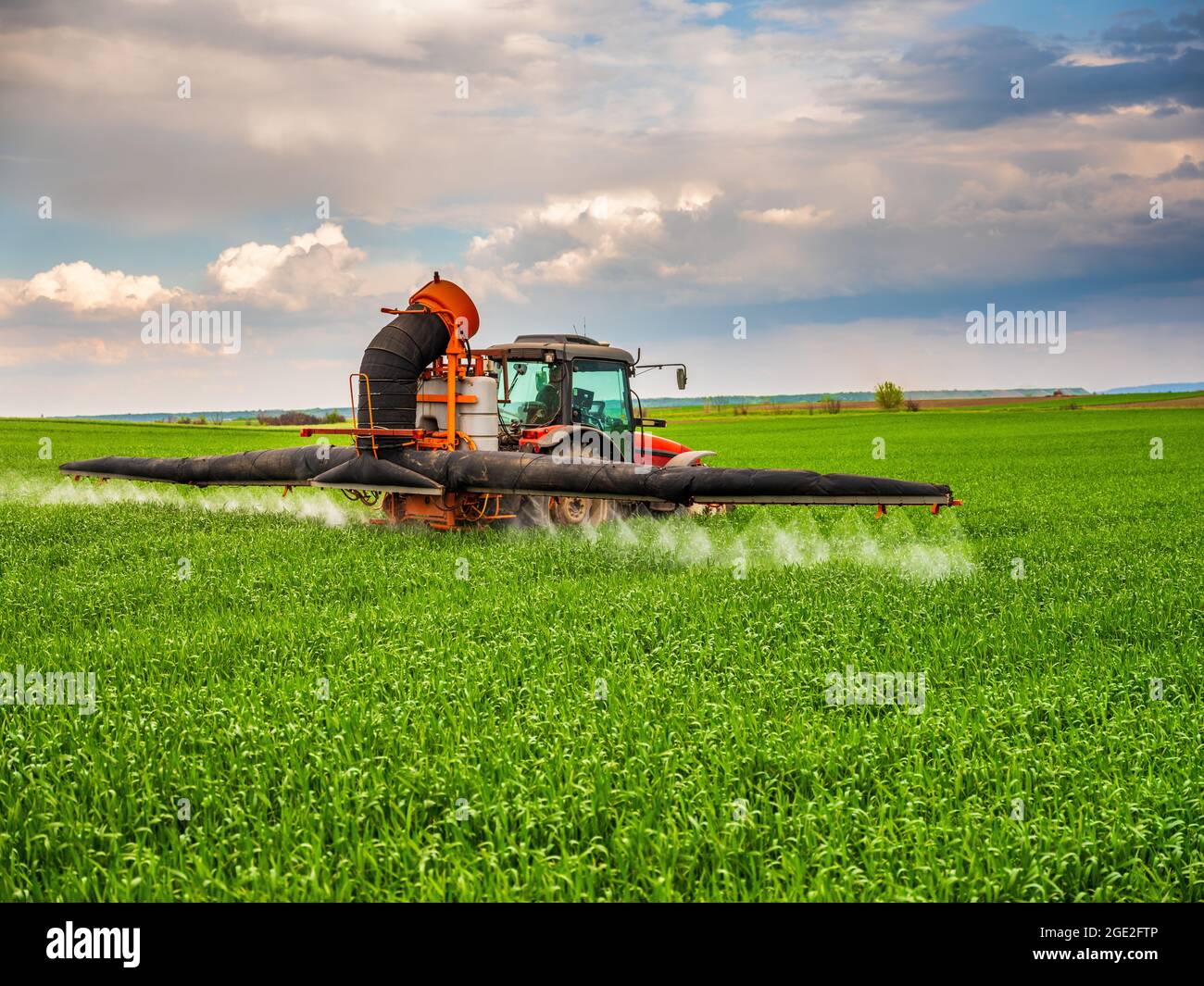Farmer spraying wheat crops Stock Photo Alamy