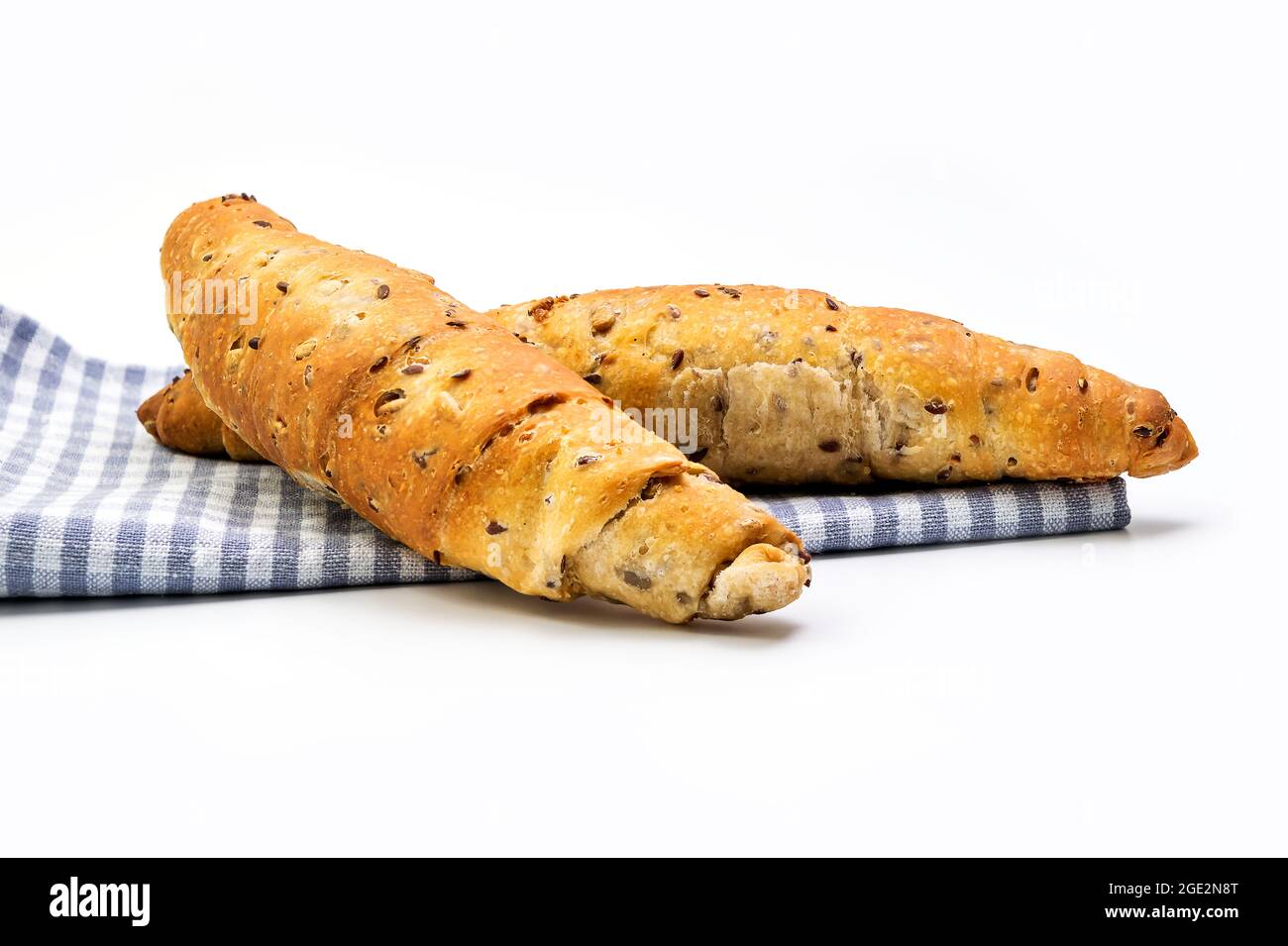 Buckwheat Rolls on a chequered blue and white cloth isolated on white