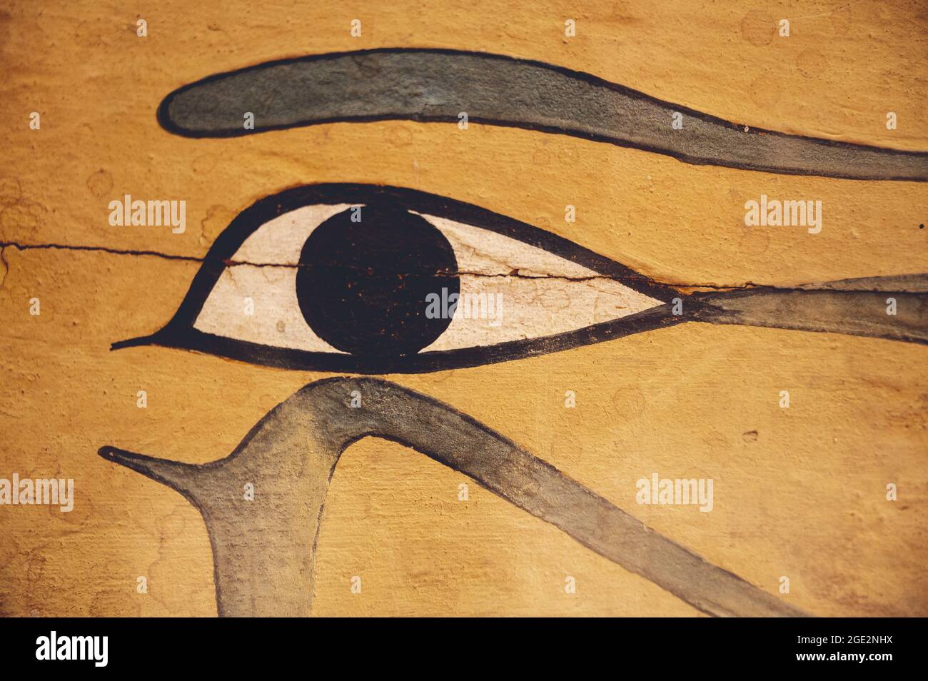 CAIRO, EGYPT - Jun 06, 2021: A closeup of an eye of Horus symbol on an aged orange  stone surface in the Egyptian Museum in Cairo Stock Photo