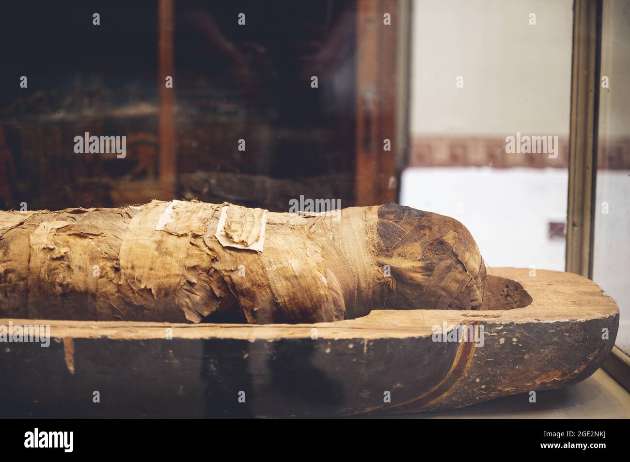 CAIRO, EGYPT - Jun 06, 2021: A closeup of a mummy with an open lid in the Egyptian Museum in Cairo, revealing a wrapped person Stock Photo