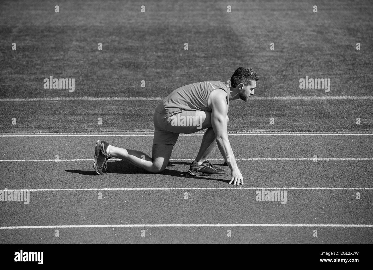 Runner ready to go. Athlete runner prepare to race at stadium. Running