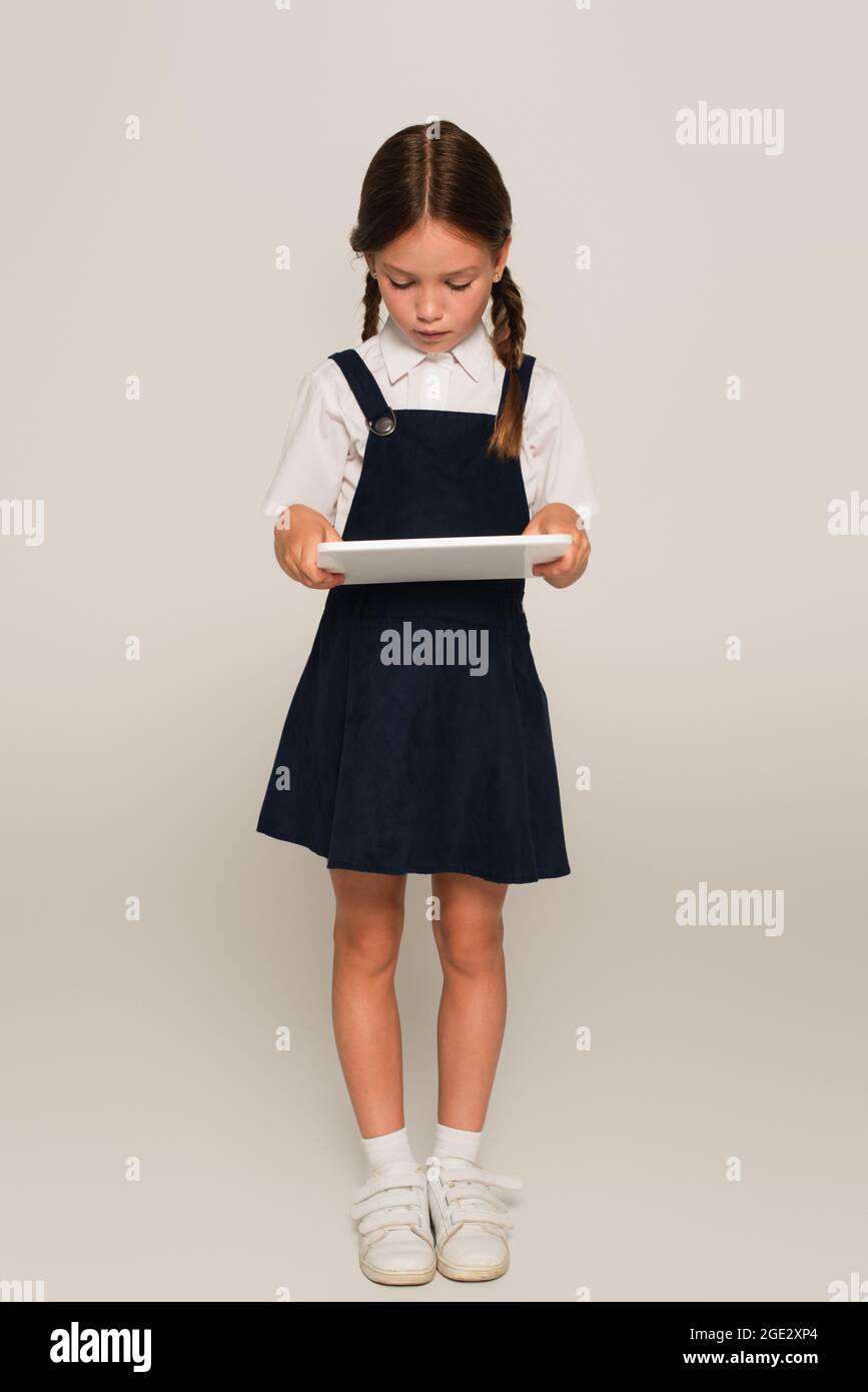 Digital tablet school uniform hi-res stock photography and images - Alamy