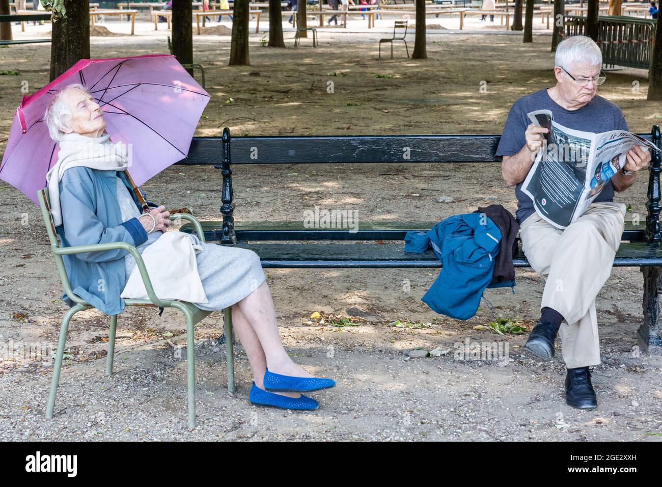 Elderly people resting in the Luxembourg Gardens in Paris Stock Photo