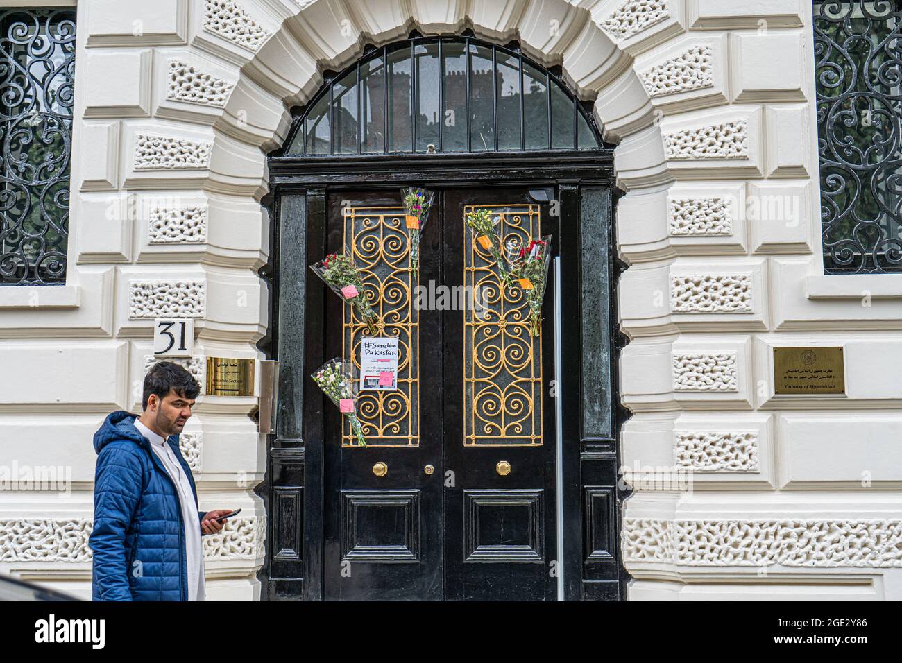 KNIGHTSBRIDGE LONDON 16 August 2021. A pedestrian walks past the front entrance of the Afghanistan foreign mission in London which is expected to close within days  as it's  diplomats face an uncertain future after the Taliban seizer power   Credit amer ghazzal/Alamy Live News Stock Photo