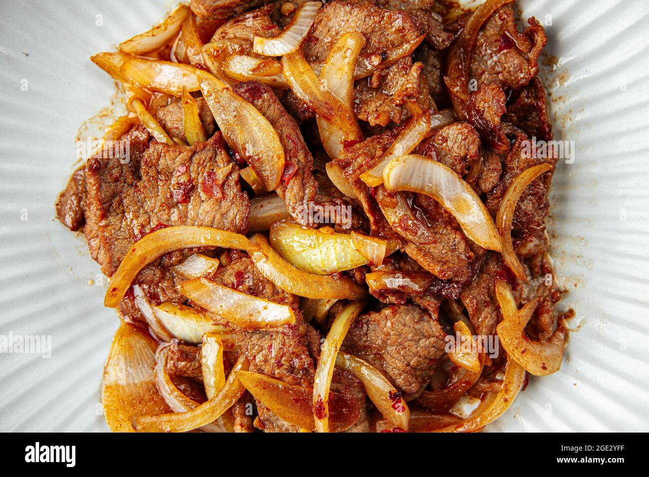 Asian spicy roast meat with onion Stock Photo