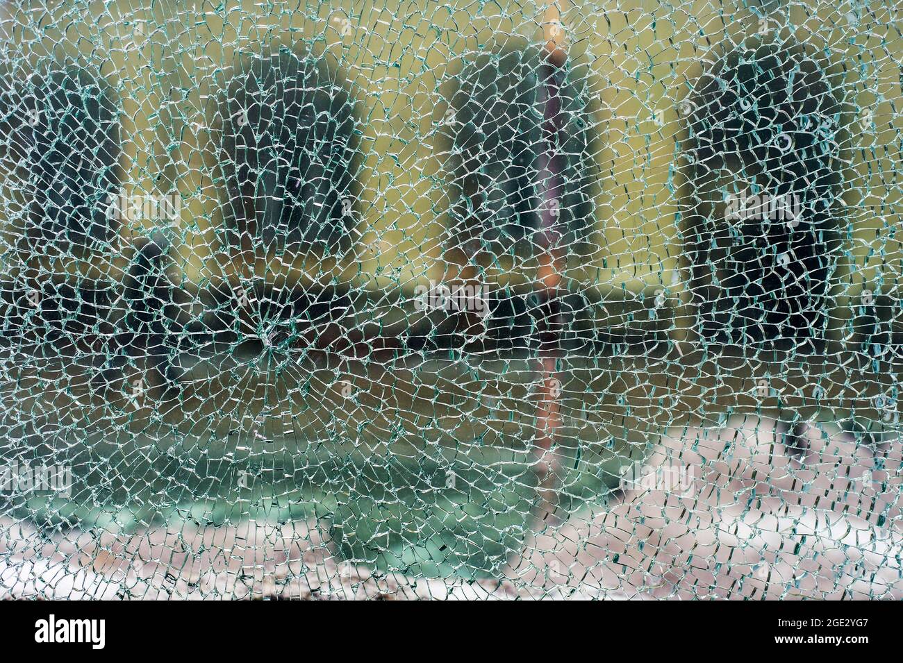 View of city through cracked glass, horizontal view Stock Photo