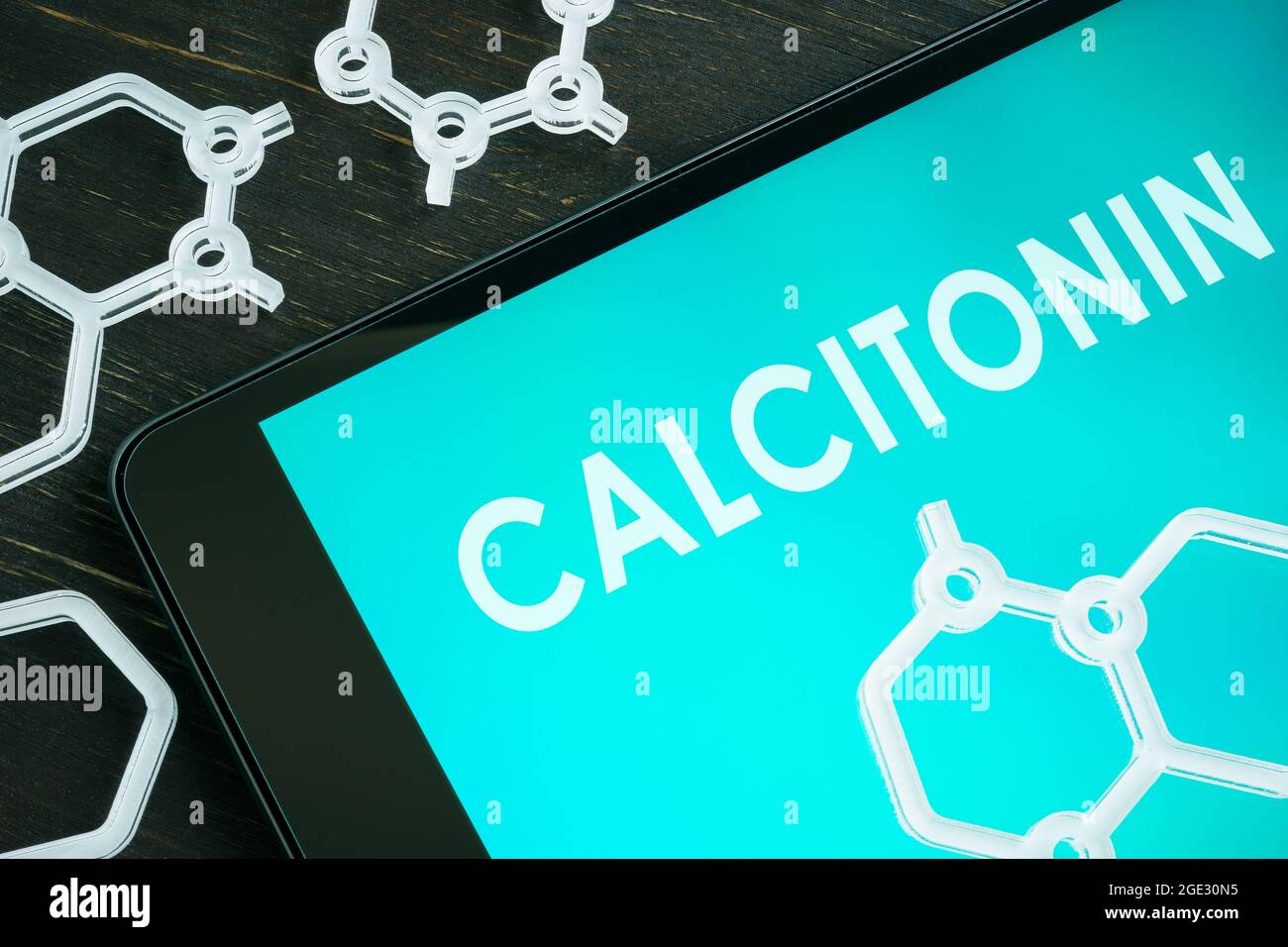 Calcitonin hormone on the notepad screen and chemical symbols. Stock Photo
