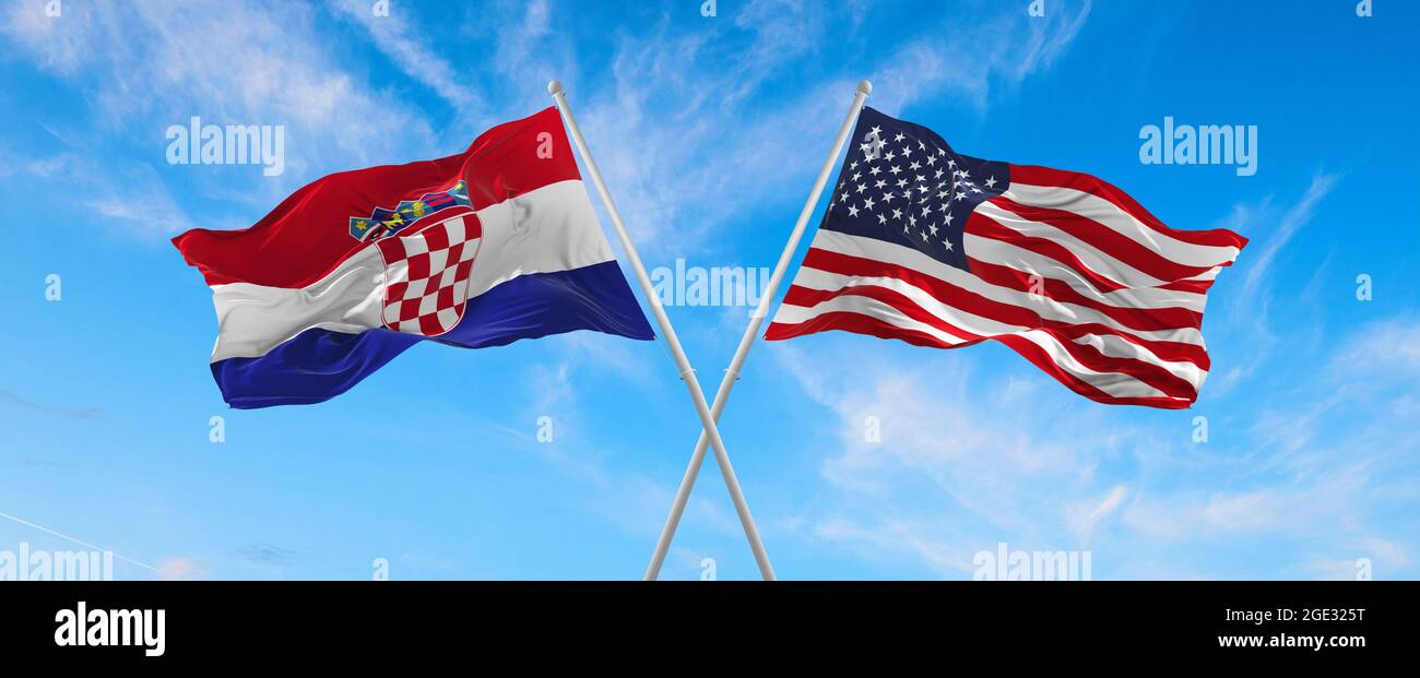 flags of USA and Croatia waving in the wind on flagpoles against the ...