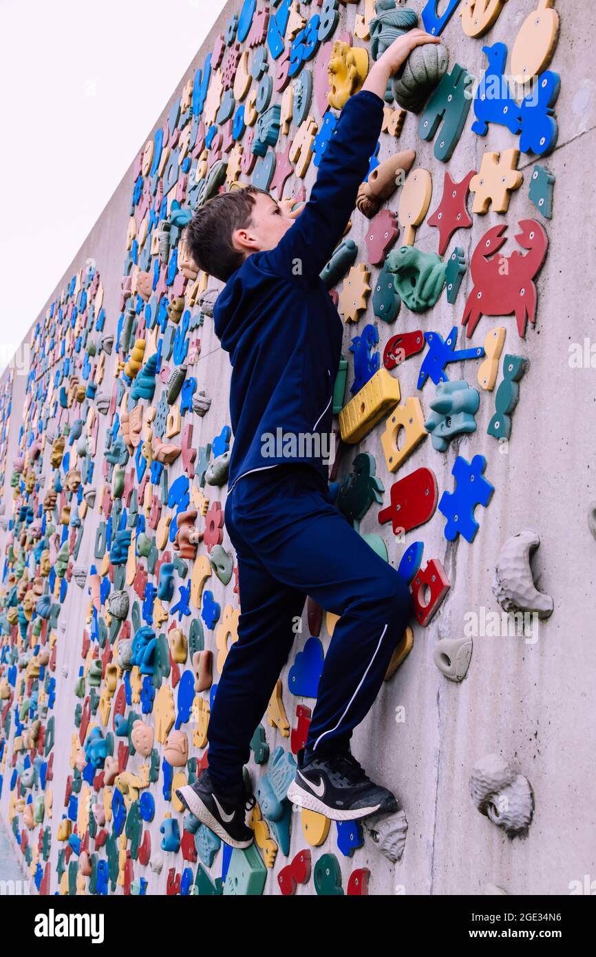 Colourful climbing wall on promenade, Letter R 'Telescope Man'  Whitmore Bay, Barry Island, Ynys y Barri, South Wales, 2021 Stock Photo