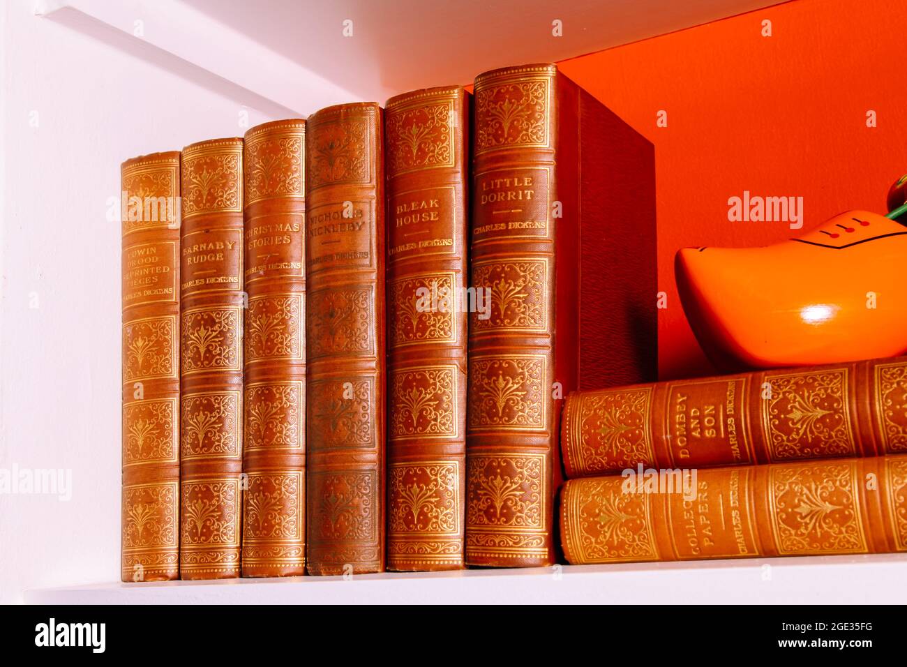 A collection of William Shakespeare novels on book shelf with clog ornament. August 2021 Stock Photo