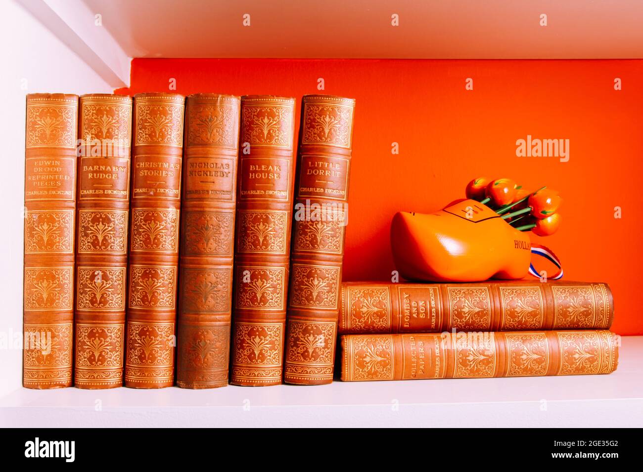 A collection of William Shakespeare novels on book shelf with clog ornament. August 2021 Stock Photo