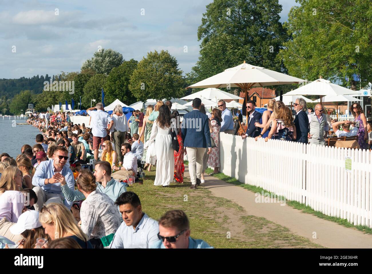 Spectators line the riverbank on Saturday(semi-finals) when Henley Royal Regatta returned after being cancelled in 2020 due to the pandemic. England Stock Photo