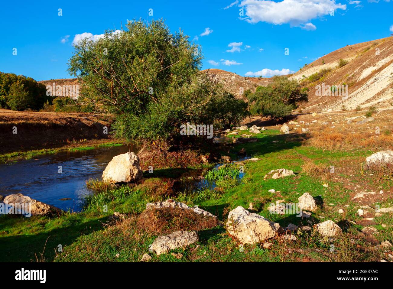 Riverside County park with big rocks on the downhill . Little river ...