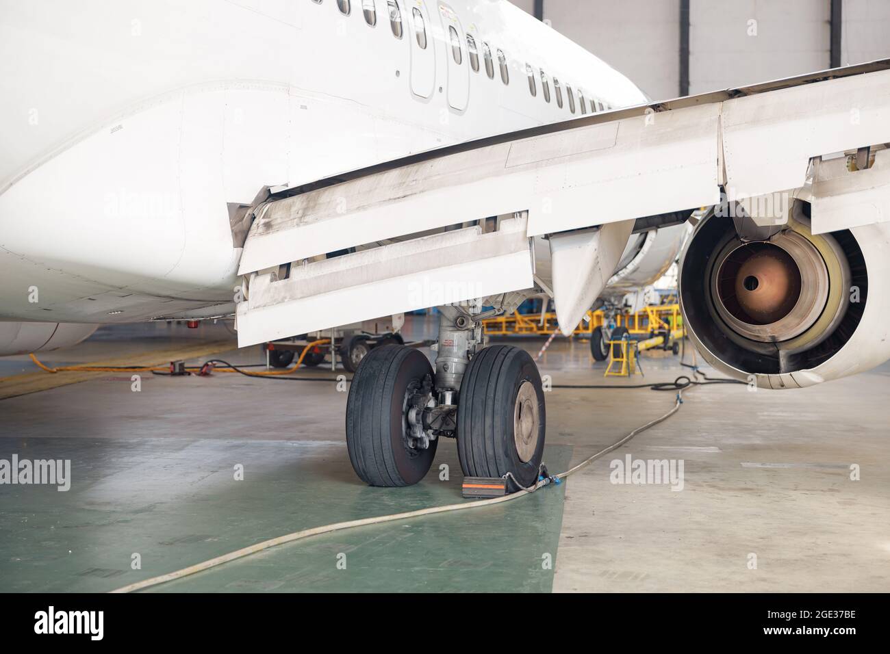 Close up shot of aircraft wheel, landing gear in airport hangar Stock Photo