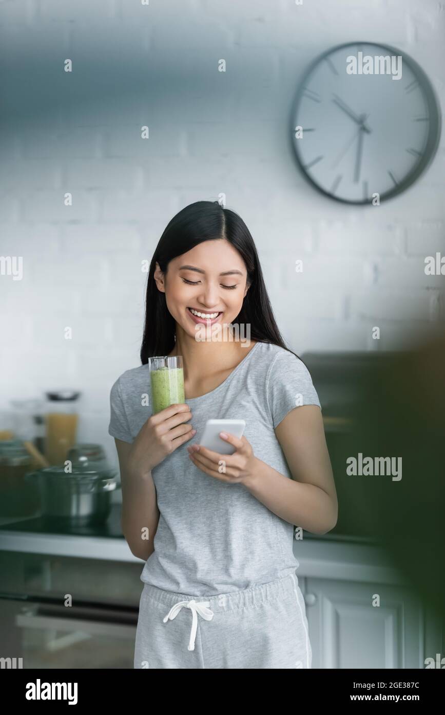 Happy pretty asian woman using hi-res stock photography and images - Alamy