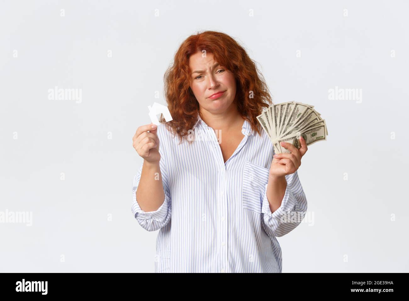 Rent, buying property and real estate concept. Unamused and sad redhead ...
