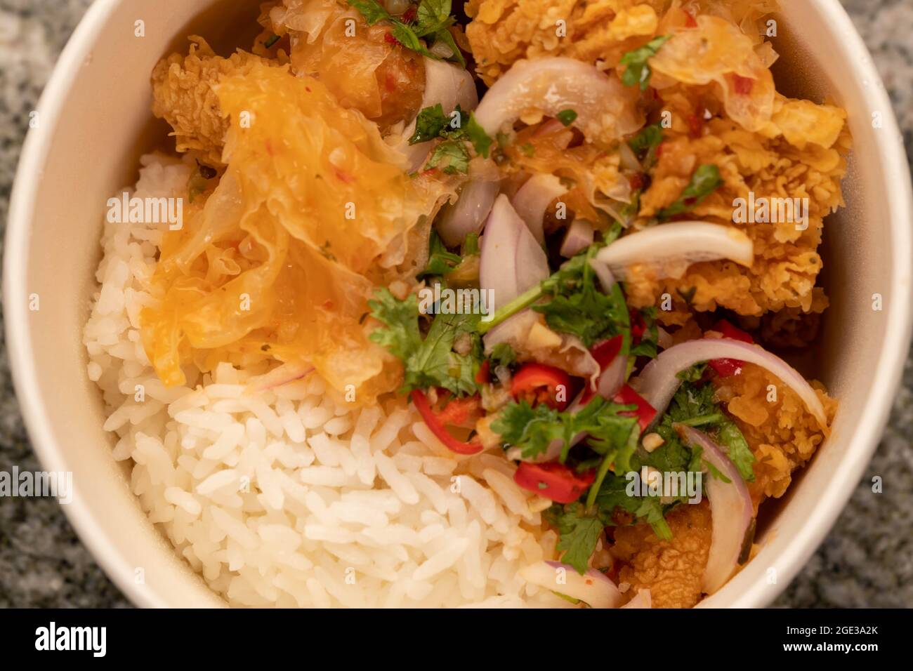 Delicious fried chicken with white rice or stream rice in the bucket ...
