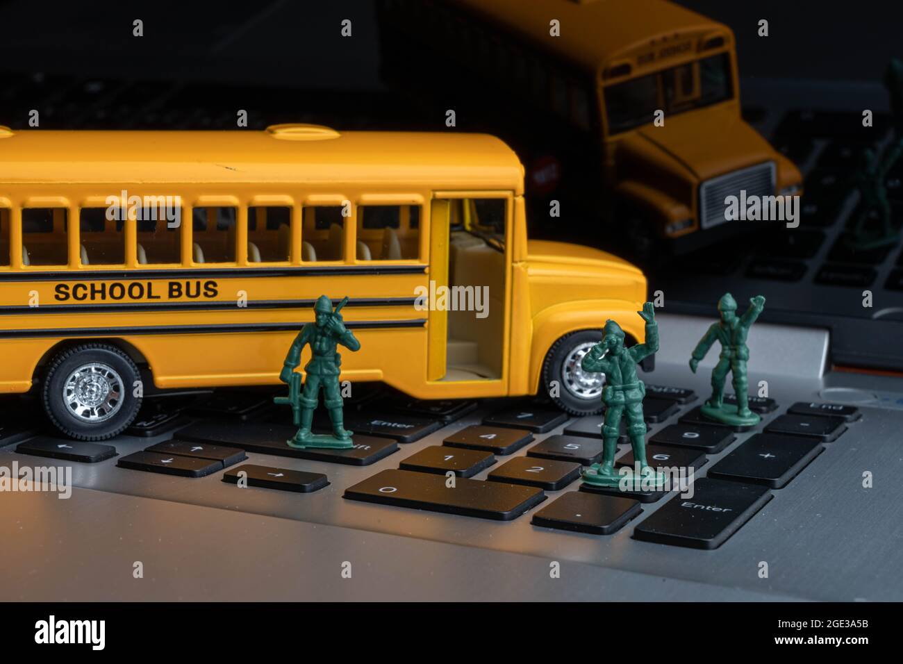 Soidier toy set protecting shoolbus concept, savety. Stock Photo