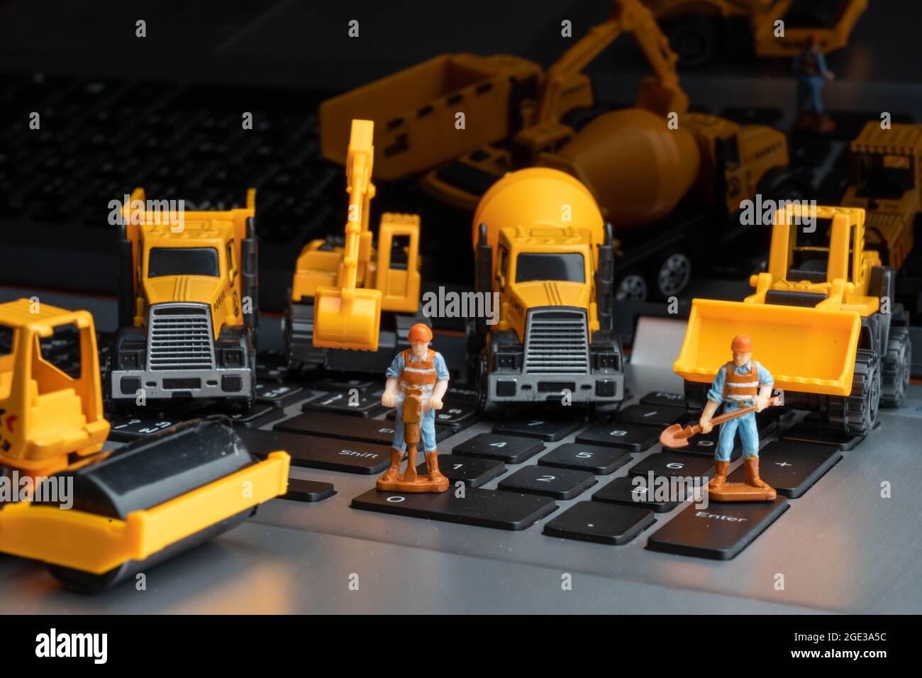 Model of Construction vehicles and model of humen construction for online builder. Stock Photo